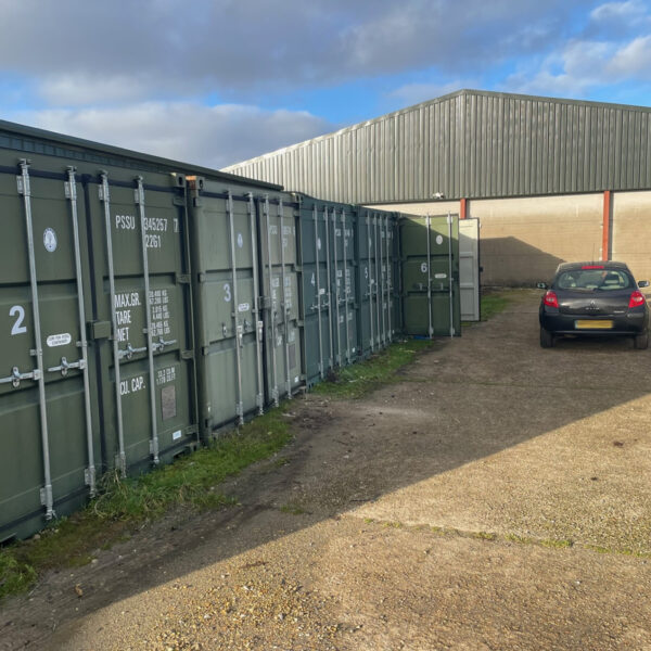 A domestic customer's car parked outside an open self storage unit